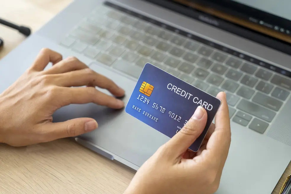 A person checking the online balance on a credit card