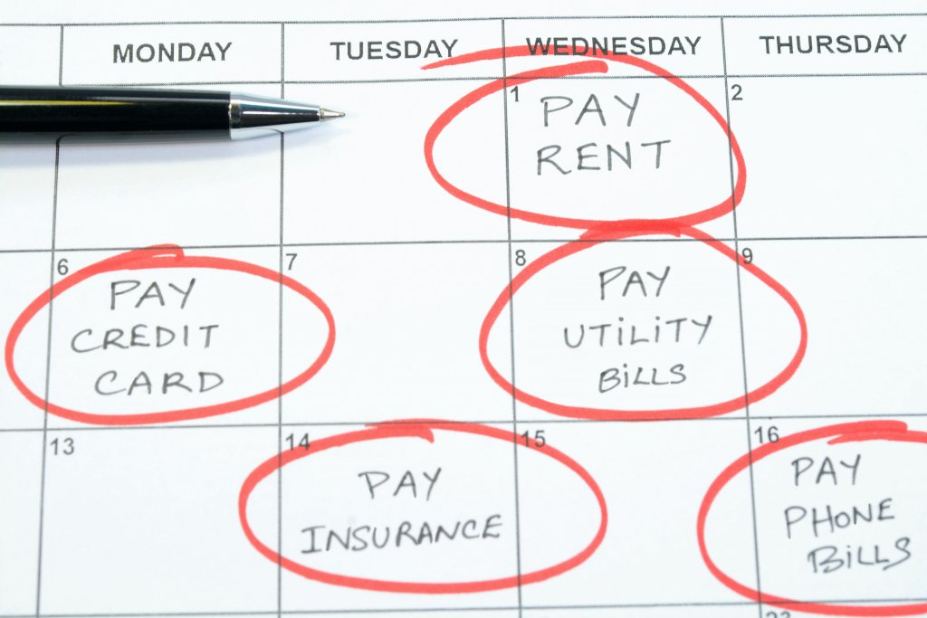 A calendar showing upcoming bill payments to pay on time to build credit.