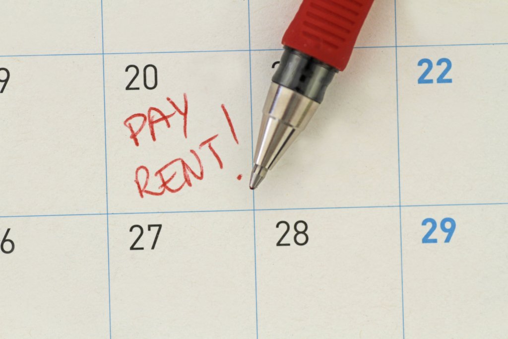 calendar with pay rent written in red