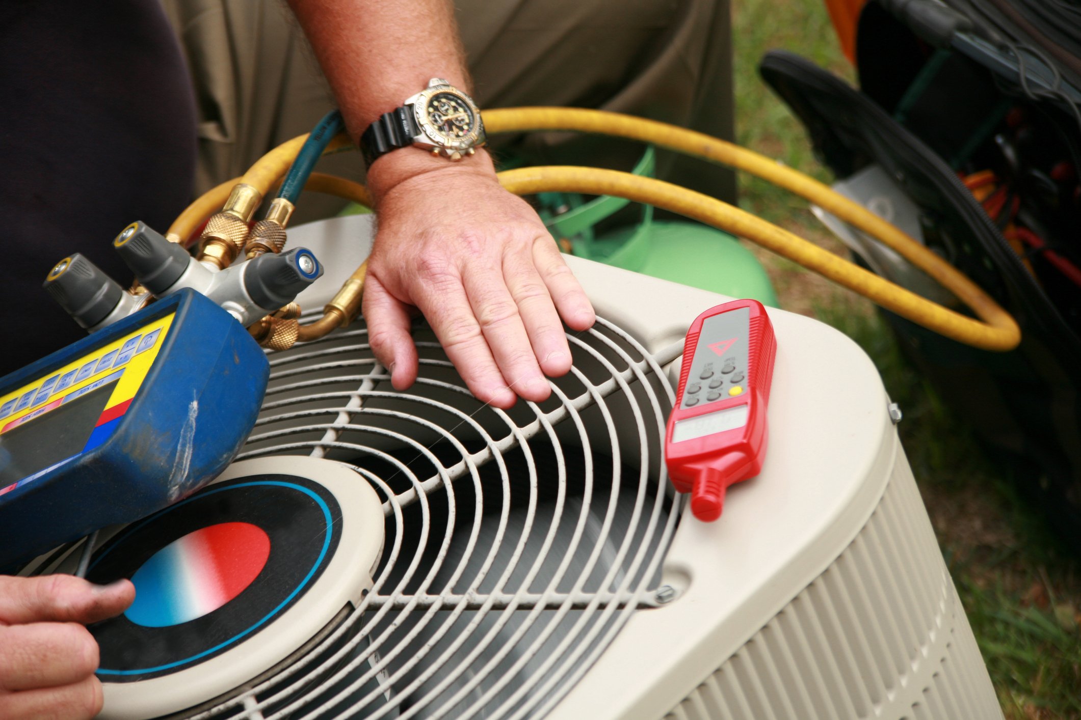 Man fixing air conditioning unit