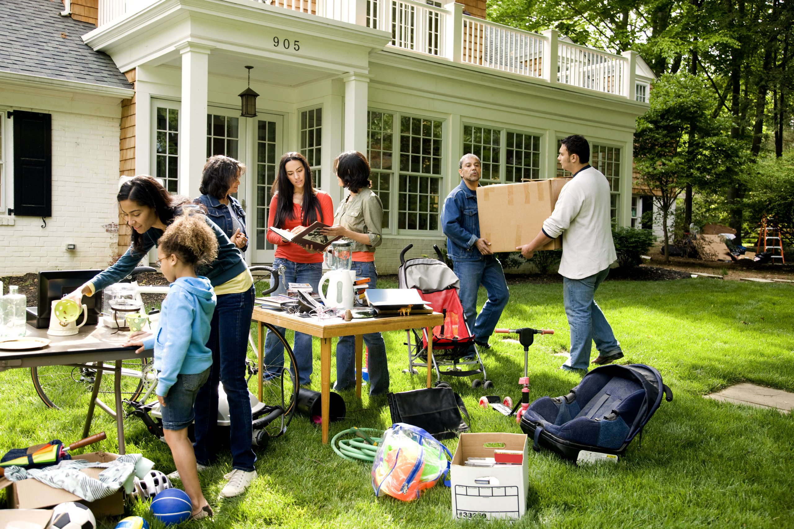 family preparing to have a yard sale