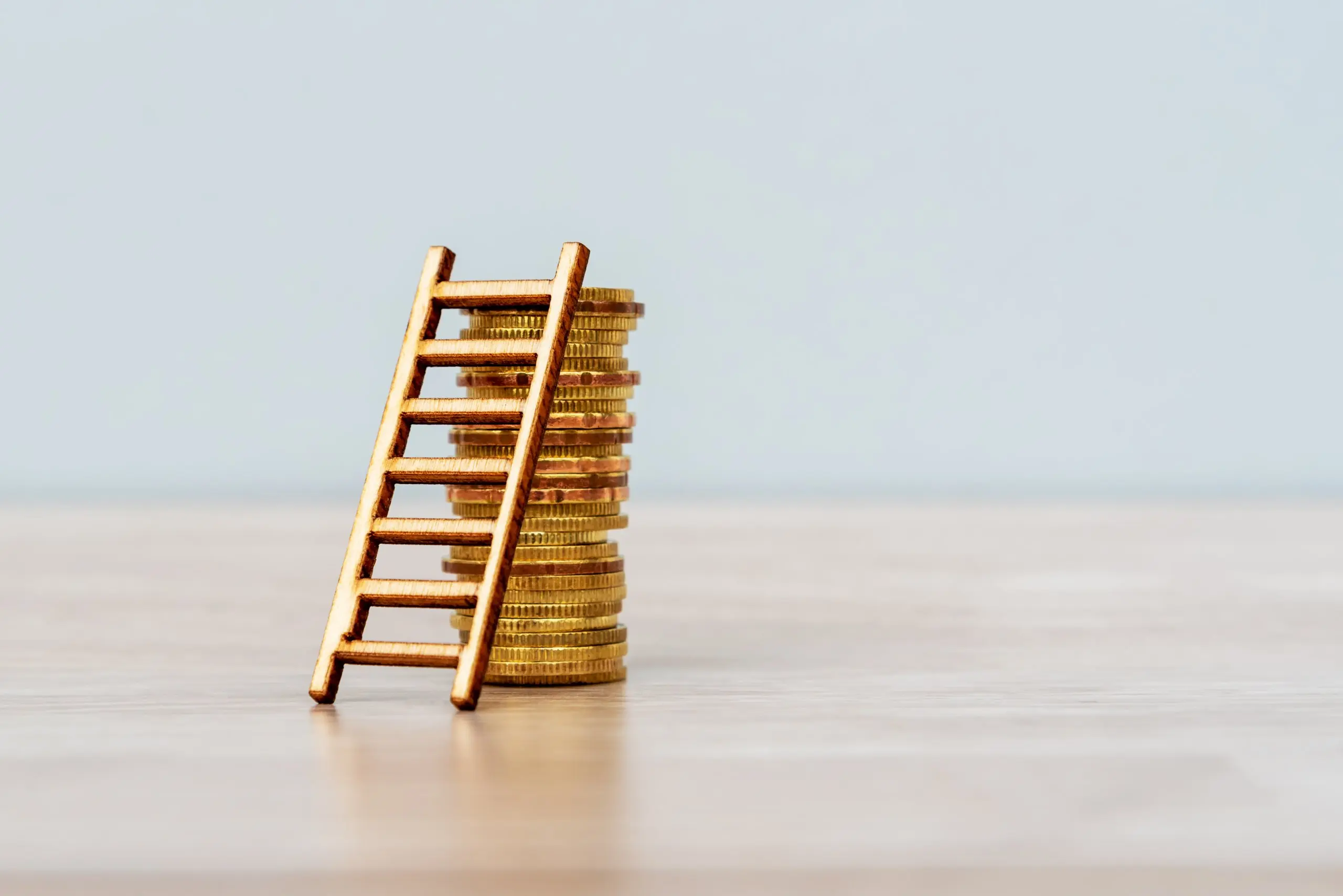 stack of coins with ladder