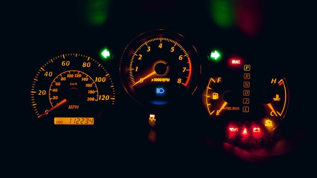 A car’s dashboard displaying various warning lights and indicators – illustrating the need for car repair loans