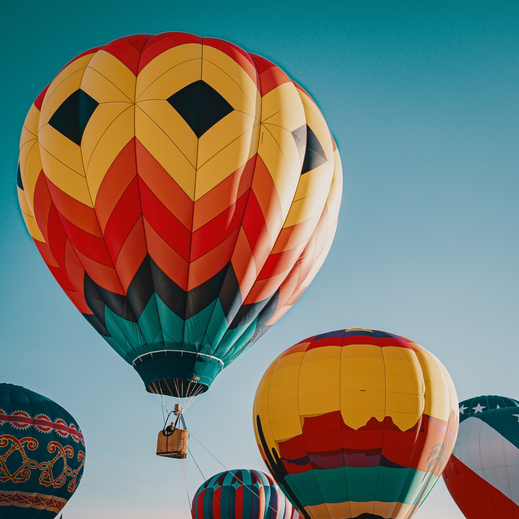 Colorful hot air balloons traveling through the sky