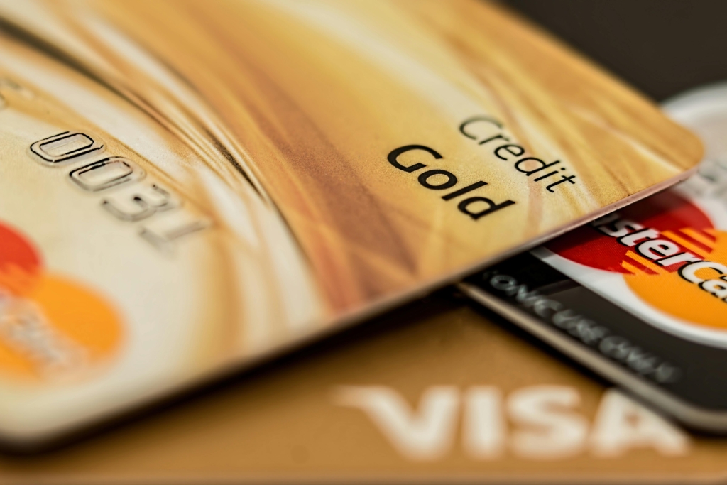 A stack of credit cards visually representing the difference between soft credit checks and hard credit checks.