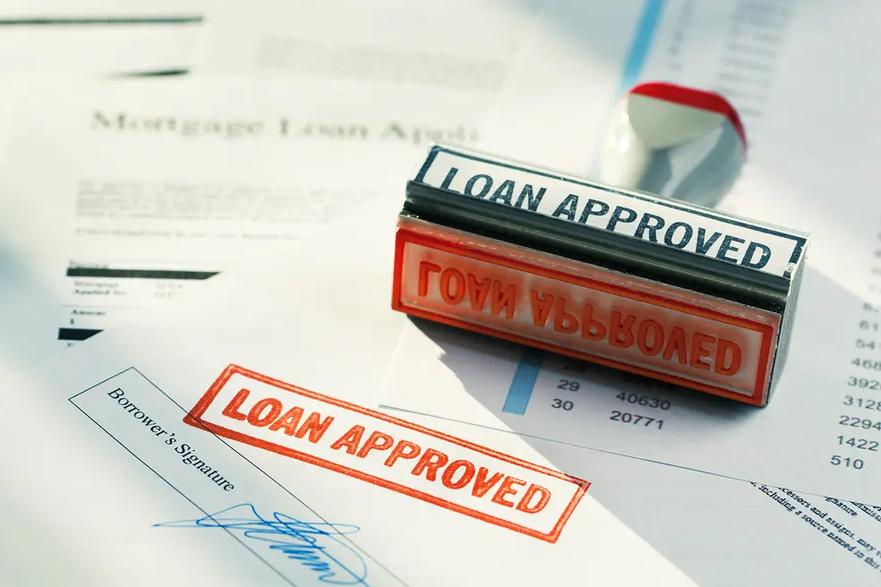 Loan document stamped with a loan approval
