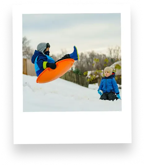Polaroid photo of kids sledding