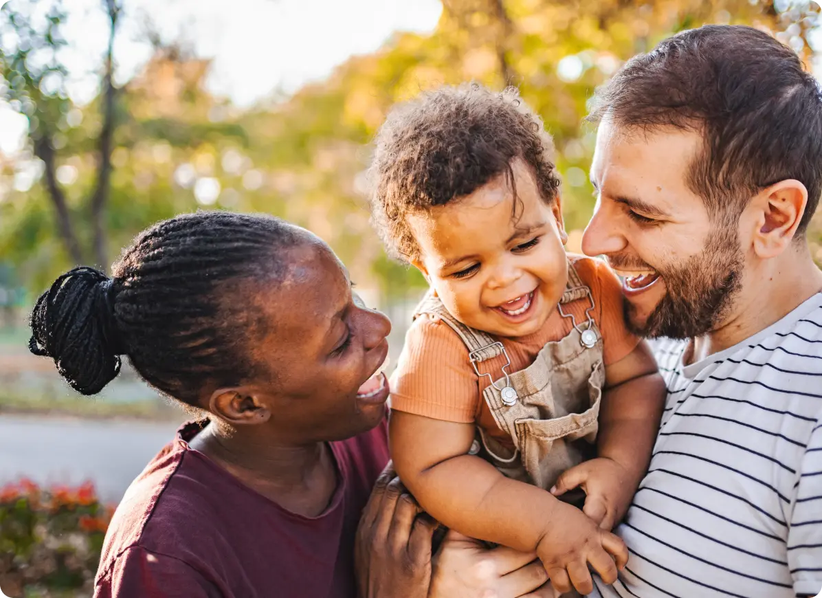 Mom and dad holding son
