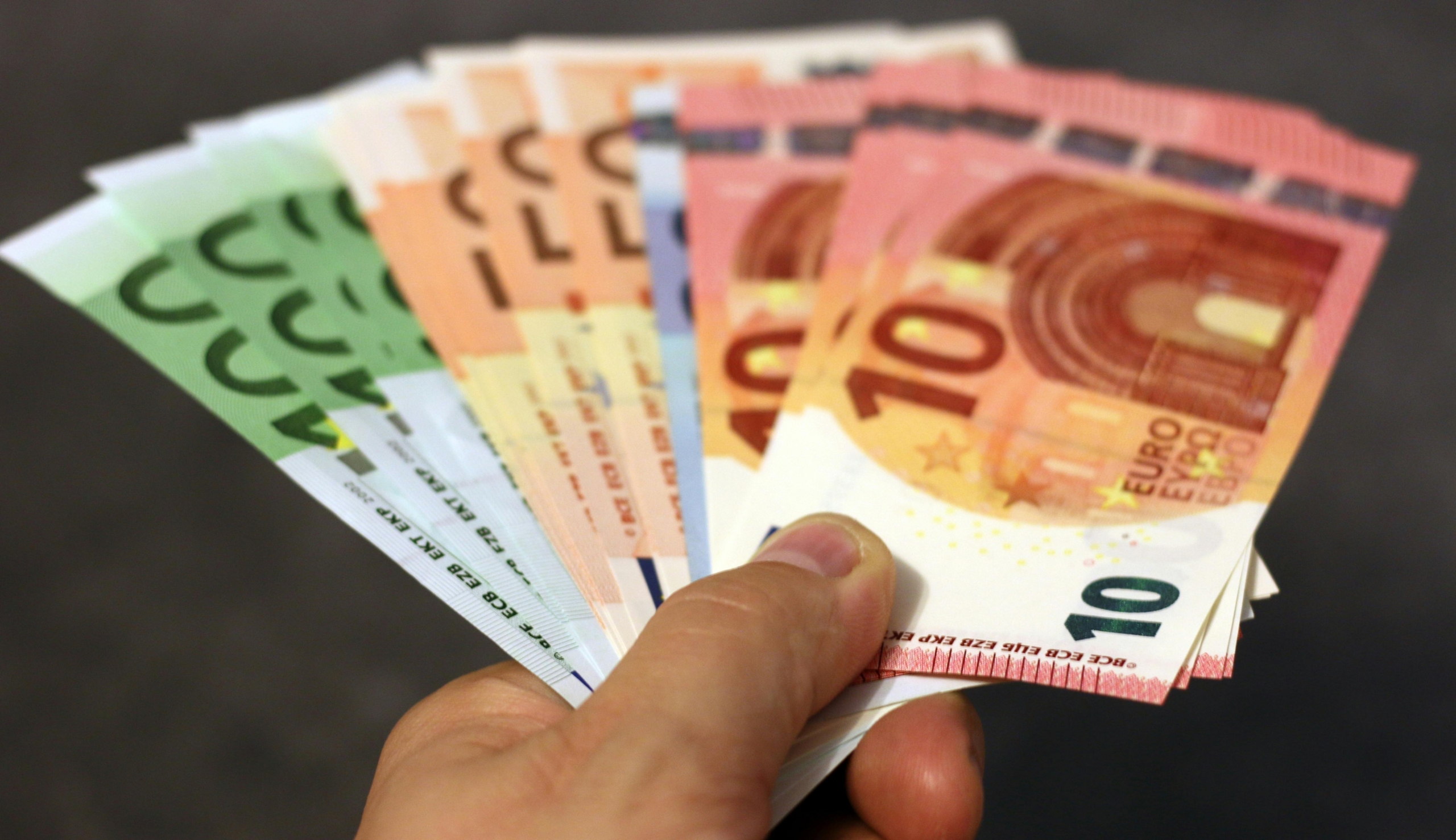 Hand holding banknotes